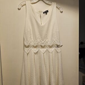 White, short dress with see through mid. Size 10.